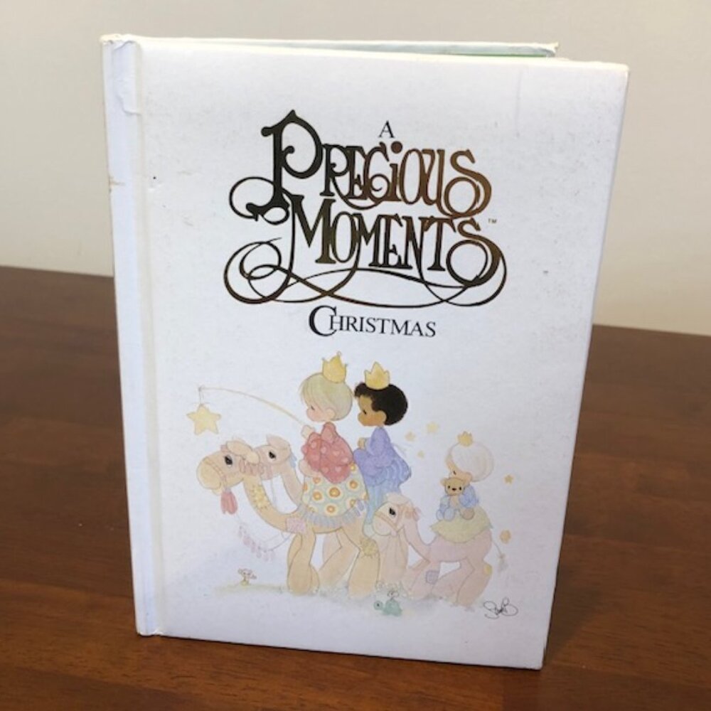 A Precious Moments Christmas Hardcover 80’s Book.